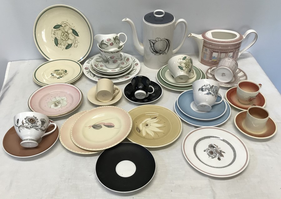 Susie Cooper collection, black fruit coffee pot, various cups and saucers, trios, side plates.