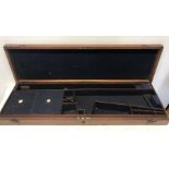 A mahogany and brass mounted gun case with fitted interior. 82 x 25 x 7.5cms.