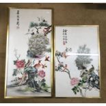 A pair of Chinese embroidered silk panels in gilt frames depicting Peacocks and other birds. 69cm
