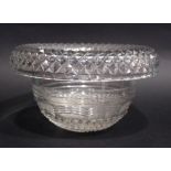 AN IRISH CUT GLASS CENTRE BOWL with diamond cut roll over rim, with angled step cut design to the