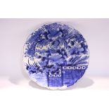 A BLUE & WHITE PORCELAIN CHARGER, with images of a pheasant amongst flowering trees in a