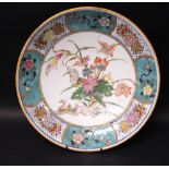 A FAMILLE ROSE PLATE, with cartouche border with floral decoration, the centre image of birds