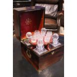 A VERY FINE MAHOGANY BRASS BOUND DECANTER BOX, with 4 glass decanters and a lift out glass holder