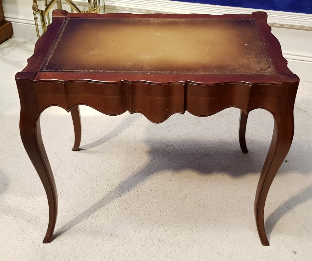 A MAHOGANY LEATHER TOPPED SIDE / COFFEE TABLE, raised on cabriole leg with shaped skirt, 26" x 17" x