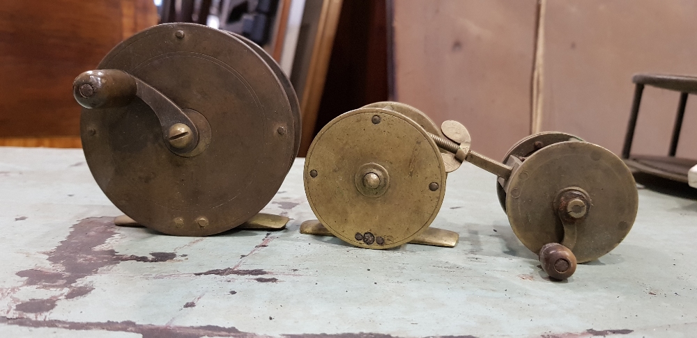 A COLLECTION OF BRASS FISHING REELS, 3 in lot, various sizes,