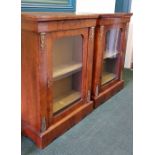 A PAIR OF 19TH CENTURY WALNUT FLOOR DISPLAY CABINETS, with glazed door, shelved interior, having