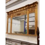 A FINE GILT OVER MANTLE MIRROR, three panel, with bevelled glass, and figural decorated top 38" x