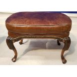 A 20TH CENTURY LEATHER & MAHOGANY FOOT STOOL, on a cabriole leg, 26" x 19" x 16" approx