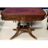 A VERY FINE MAHOGANY REGENCY BRASS INLAID FOLD OVER CARD TABLE, with lyre shaped supports on a