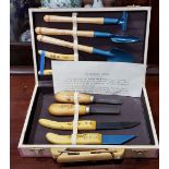 A CASED SET OF MINIATURE GARDENING TOOLS, decorated with scenes from the Chinese provence of Hebei