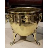 A POLISHED BRASS JARDINERE STAND - with pierced sides, raised on paw feet, 13.5" tall 13.5" wide