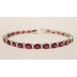 AN 18CT WHITE GOLD RUBY & DIAMOND TENNIS BRACELET