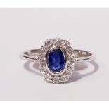 A 9CT SAPPHIRE & DIAMOND RING