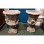 A PAIR OF STONE GARDEN URNS, with classical decoration, 21" x 16" approx H x W
