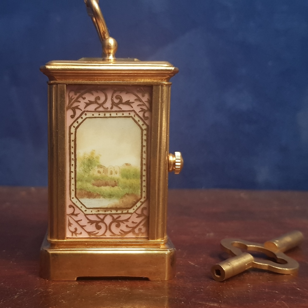 A MINIATURE BRACKET CLOCK, with picture panels and bevelled glass, key with the clock - Image 2 of 4