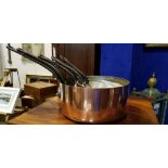 A SET OF 5 COPPER SAUCE PANS with cast iron handles