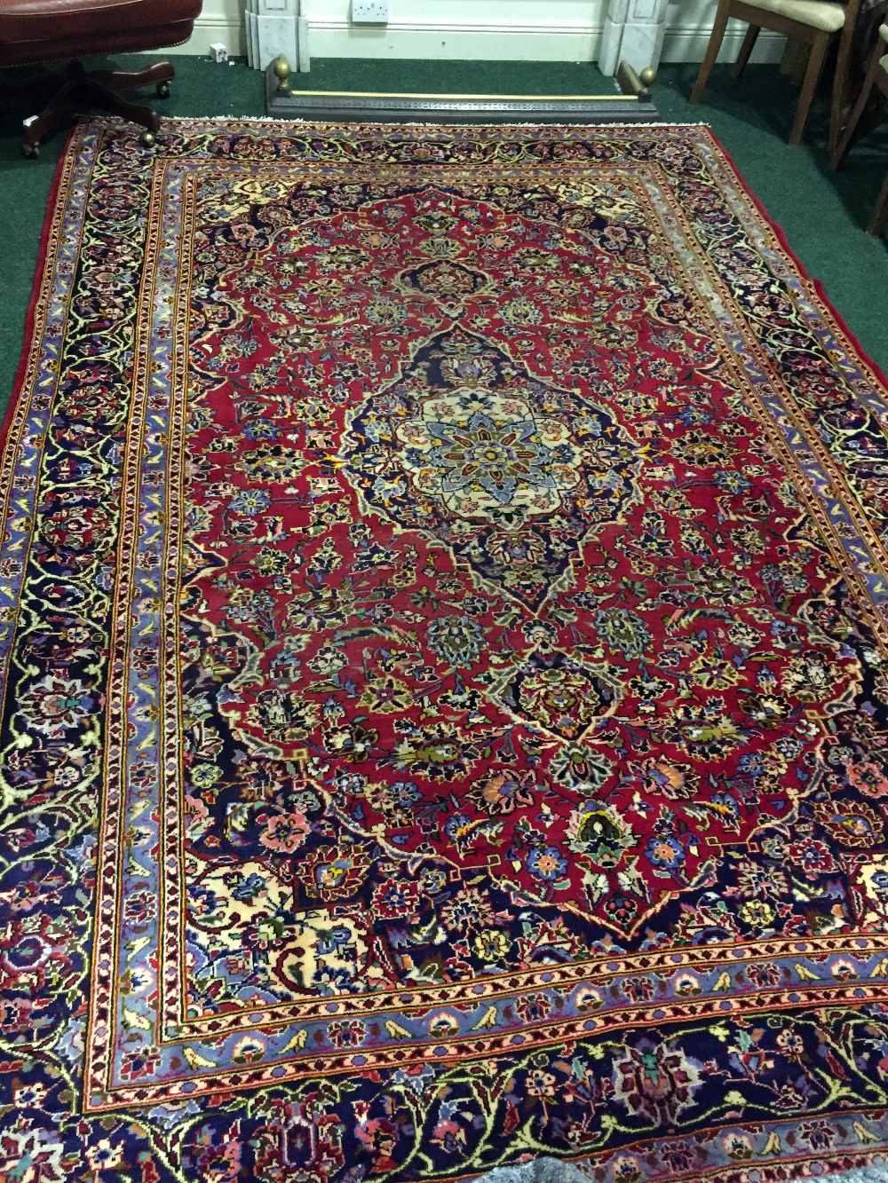 A PERSIAN KASHAN RUG, hand-knotted and woven, the design is inspired by old 16th century design