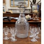 AN IRISH 19TH CENTURY CUT GLASS DECANTER, with stopper & 6 sherry glasses, some marked Waterford