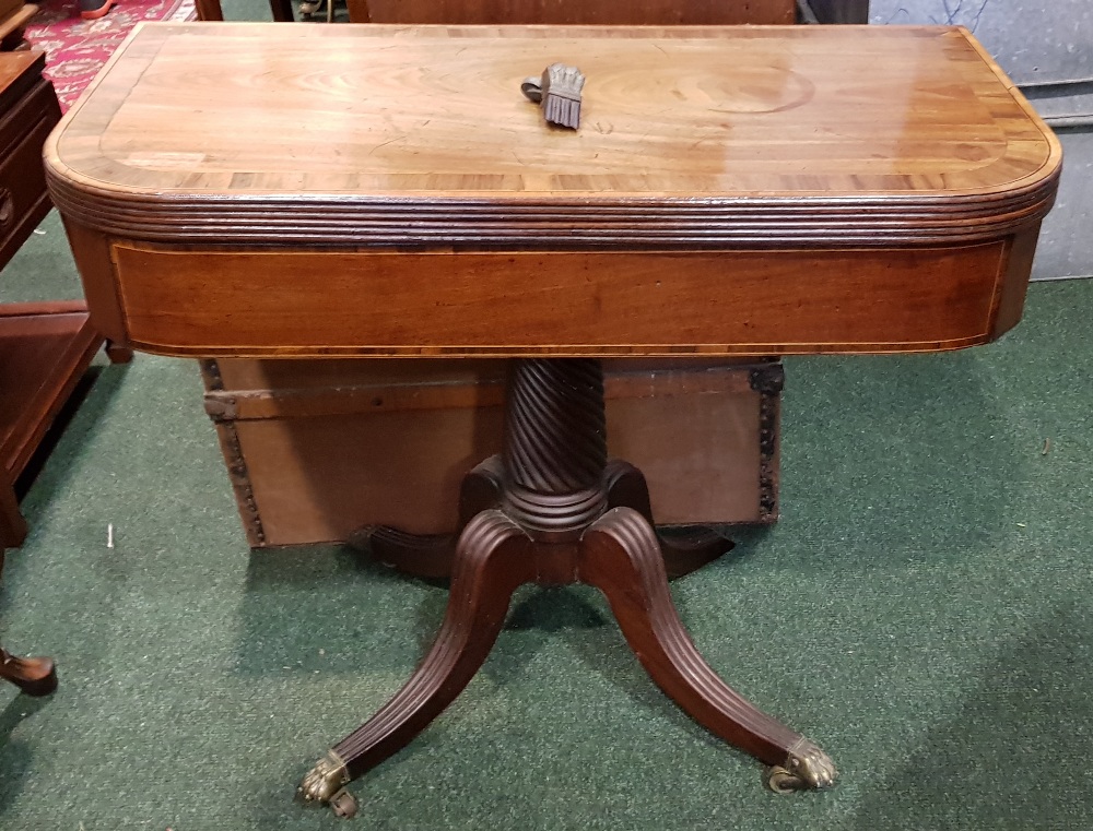 A 19TH CENTURY MAHOGANY & CROSSBANDED FOLD OVER TEA TABLE, raised on four shoot pod, with turned