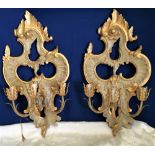 A PAIR OF CARVED WOODEN & GILT WALL SCONES, each with 3 heads, 66 x 34 each approx