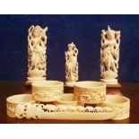 A MIXED LOT OF CARVED ORNAMENTS, with three carved napkin rings & a letter opener (7 items)