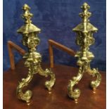 A PAIR OF LATE 19TH CENTURY FINE QUALITY CAST POLISHED BRASS & STEEL FIRE DOGS, 17" tall approx, 13"