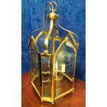 A GOOD QUALITY BRASS & GLASS HANGING HALL LANTERN, octagonal in shape, with bevelled glass,