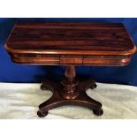 A VERY FINE WILLIAM IV ROSEWOOD FOLD OVER CARD TABLE, raised on a turned column support, quadra form