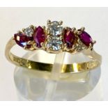 A 14CT YELLOW GOLD RING SET WITH 8 STONES, 4 Garnet & 4 White Sapphires, marked 585 for 14ct gold,