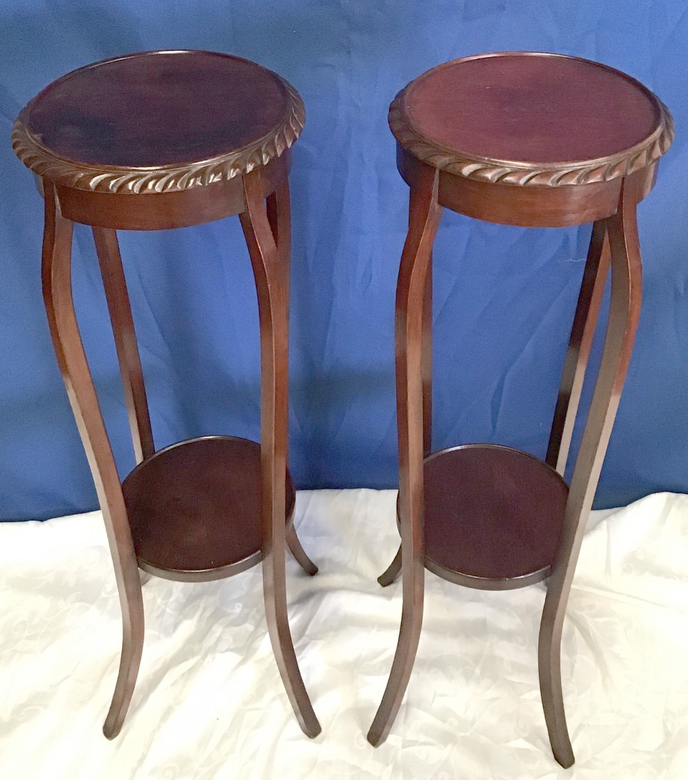 A PAIR OF MAHOGANY 'POT STANDS' circular top with gadrooned rim, raised on four shaped legs,