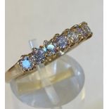 A 9CT YELLOW GOLD 7 STONE ETERNITY RING, hallmarked, in a claw setting, lovely weight and very