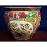 A CHINESE PORCELAIN JARDINIÈRE POT, octagonal in shape, with painted panel pictures of birds,