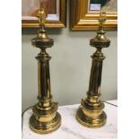 A PAIR OF BRASS TABLE LAMPS, with fluted columns, and step decoration to bases, 22" tall without