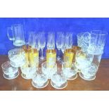 A MIXED GLASS LOT, includes champagne flutes, beer jugs, water glasses & dessert glasses