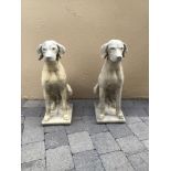 A PAIR OF STONE GARDEN ORNAMENTS IN THE FORM OF HOUNDS, 73 high approx