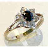 A 9CT YELLOW GOLD 7 STONE CLUSTER DRESS RING, IRISH MADE, hallmarked, centre stone oval shaped