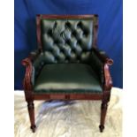 A GOOD QUALITY BUTTON BACKED LEATHER LIBRARY / DESK CHAIR, with reeded wooden frame, carved floral