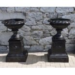 EXCEPTIONALLY FINE PAIR OF CAST IRON GARDEN URNS ON PLINTHS. Classical decoration, approximately 3ft
