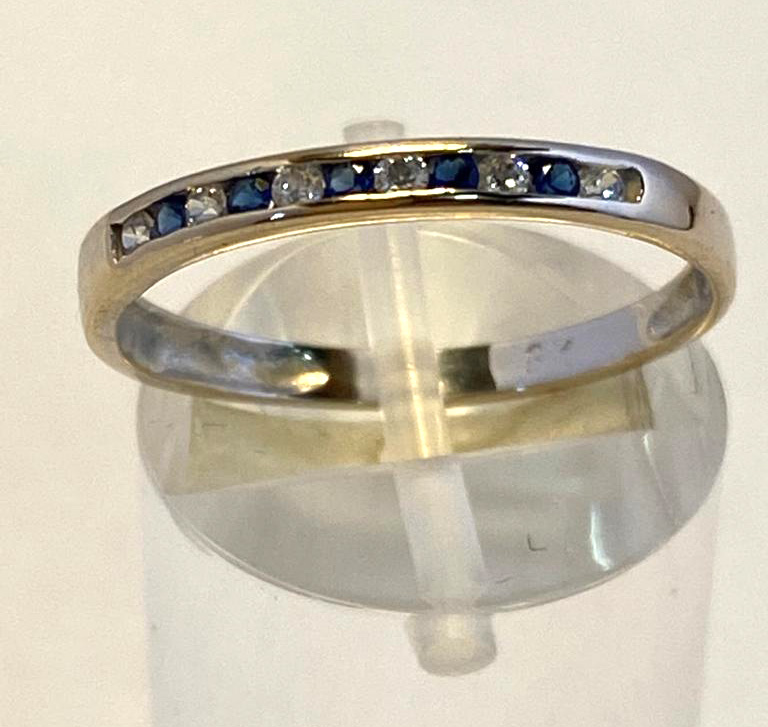 A 9CT WHITE GOLD SAPPHIRE & DIAMOND BAND, in a channel setting, 5 sapphire stones and 6 diamonds,