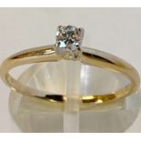 A 14CT YELLOW GOLD RING SOLITAIRE DIAMOND RING, with round brilliant cut diamond in a claw