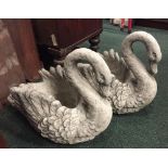 A PAIR OF GARDEN ORNAMENTS / STONE JARDINIÈRE POTS IN THE FORM OF SWANS, 16" tall approx, 18" wide