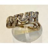 A 9CT YELLOW GOLD RING, with the letters MUM finished with cubic Zirconias is a lovely expression of