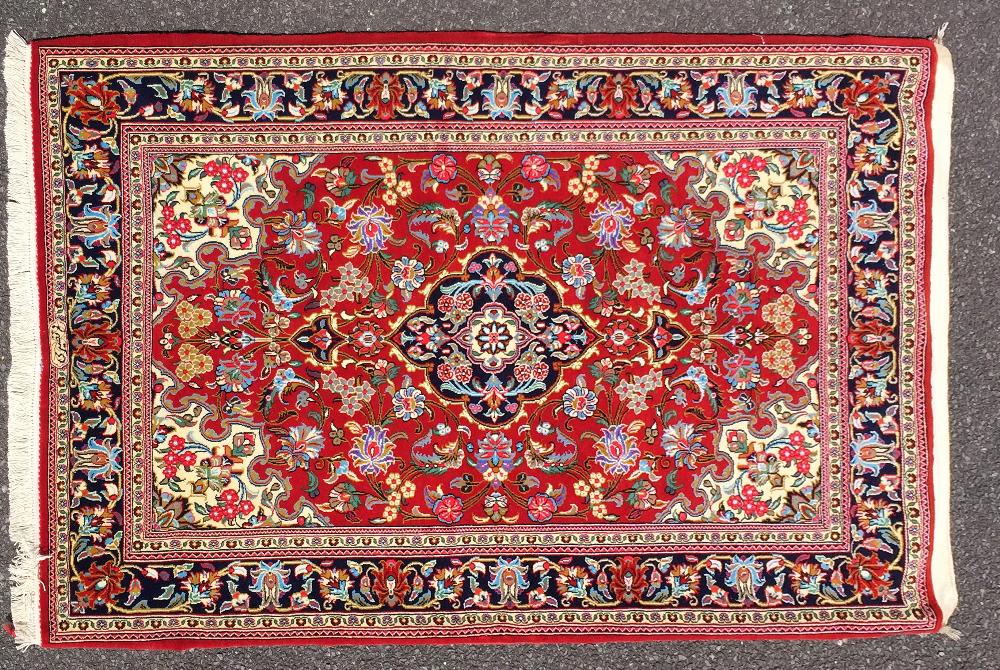 A VERY FINE 20TH CENTURY PERSIAN ‘QUM’ WOOL FLOOR RUG, in excellent condition, it once hung on the