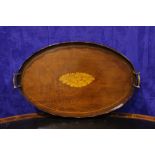 AN OVAL TRAY with raised scalloped sides, brass handles and inlaid conch shell to the centre, 25.