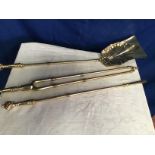 A FINE SET OF BRASS FIRE IRONS, with engraved decorative detail to the tong handles, each tipped