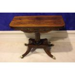 AN EXCEPTIONALLY FINE REGENCY ROSEWOOD FOLD OVER TEA TABLE, with decorative carved frieze, raised on