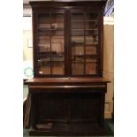 A VERY FINE 19TH CENTURY GLAZED BOOKCASE, two door bookcase, over 2 drawers, supported by turned