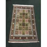 A VERY FINE PERSIAN SILK ‘QUM’ FLOOR RUG, hand knotted, with ‘cypress tree of life’ motif, with