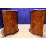 A VERY FINE PAIR OF KINGWOOD MARBLE TOPPED CORNER CABINETS, bow fronted, decorated with fine