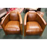 A PAIR OF 'AVIATOR' CLUB ARMCHAIRS, with leather seats in a wooden frame, with ebonised fluted